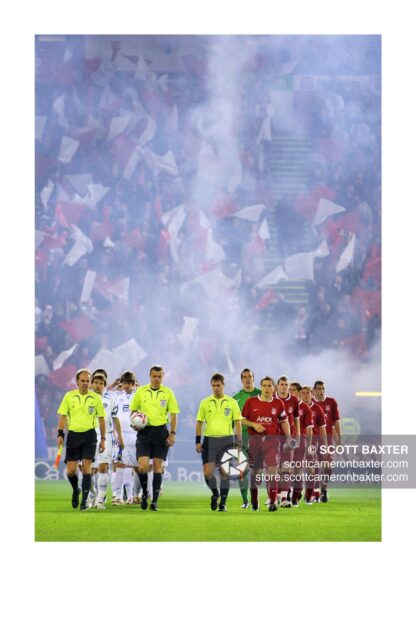 A photograph of players from Aberdeen Football Club and Dnipro walking out to play at Pittodrie Stadium,
