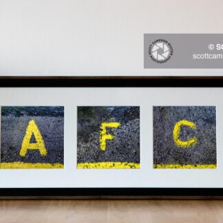 Picture of a 3 aperture frames with square prints displaying A F C yellow painted step markers in a black frame with white mount.